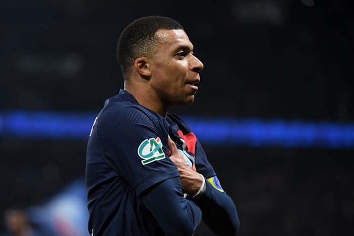 Kylian Mbappe pictured standing with his arms folded while celebrating a goal for Paris Saint-Germain in a 3-1 win over Nice in March 2024